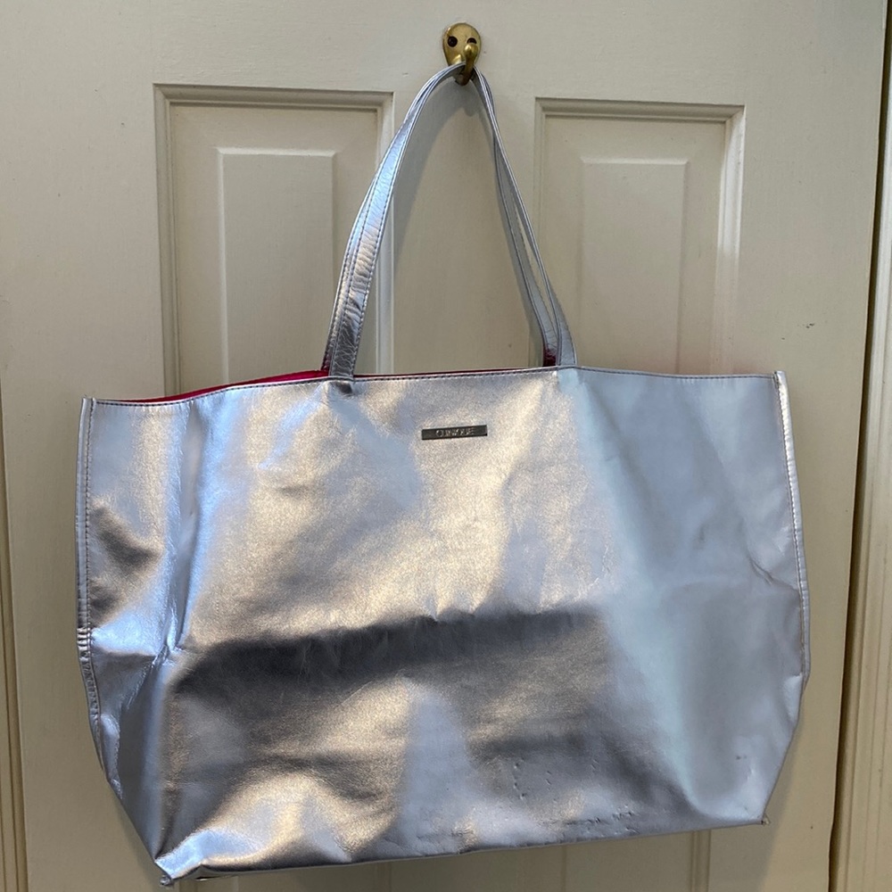 Silver Clinique tote with hot pink liner
